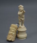 A Dieppe ivory cherub and a bone and horn smoking pipe, length 15cm