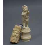 A Dieppe ivory cherub and a bone and horn smoking pipe, length 15cm