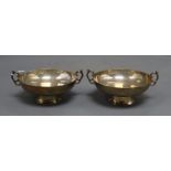 A pair of George V silver two handled bonbon dishes, Sheffield, 1929/30, diameter 10.1cm, 8 oz.