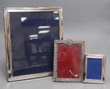 A late Victorian silver mounted photograph frame, Chester, 1896 and two modern silver frames,