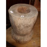 A carved wood mortar, H.55cm