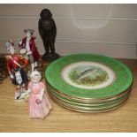 Three porcelain figures and eight plates, and a resin figure of a diver, etc.CONDITION: The figure