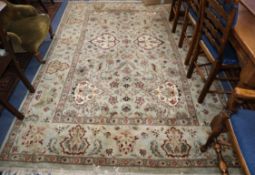 Two Indian green ground carpets, larger 210 x 185cm