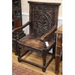 A pair of carved oak 'Wainscot' chairs, W.60cm, D.60cm, H.110cm