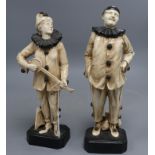 Two rare Bretby Art pottery figures of pierrots, c.1910, impressed 2696 and 2700, 29.5 and 31cm
