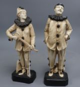 Two rare Bretby Art pottery figures of pierrots, c.1910, impressed 2696 and 2700, 29.5 and 31cm