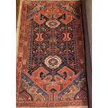 A Hamadan blue ground rug, 130 x 80cm
