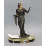 An Art Deco style resin and bronze figure, signed Menneville, overall height 41cm