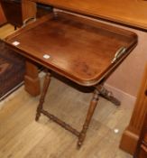 An oak butler's tray on folding stand, W.70cm D.50cm H.74cm