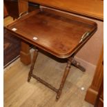 An oak butler's tray on folding stand, W.70cm D.50cm H.74cm