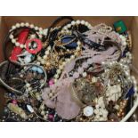 A box of assorted costume jewellery.