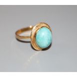 A modern continental yellow metal (tests as 18ct) and oval turquoise dress ring, size P, gross 3.2