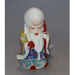 A Chinese famille rose figure of Shou Lao, height 15cmCONDITION: A small patch of loss of veneer