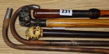 Five walking canes including one silver mounted