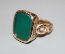 A 19th century yellow metal and chrysophase? set signet ring, size M, gross 7.2 grams.CONDITION: