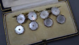 A set of four 18ct and plat, mother of pearl and diamond set dress studs and a pair of 9ct and