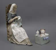 A Lladro figure of a lady sewing and a Nao group of kittens