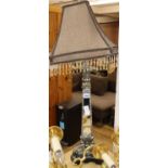 A gilt and silvered metal table lamp with mirrored triangular column