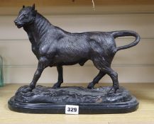 A bronze of a bull, on a marble base, signed A.L. Barye, height 27cm