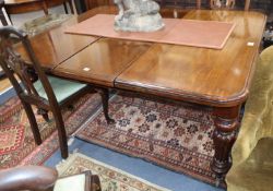 A Victorian mahogany extending dining table, L.280cm extended (three spare leaves) D.125cm, H.72cm