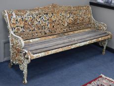 A Victorian Coalbrookdale cast iron garden bench with oak slatted seat, L.182cm, D.64cm, H.