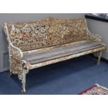 A Victorian Coalbrookdale cast iron garden bench with oak slatted seat, L.182cm, D.64cm, H.