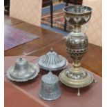 Three Indo-Persian tinned lidded dishes and a brass hu'qqa base table lamp, largest 43.5cm