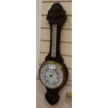 A late Victorian carved oak wheel barometer, H.78cm