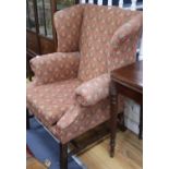 A George III style mahogany framed wing armchair