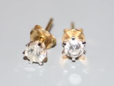 A pair of diamond and 18ct gold stud earrings, each stone approximately 0.22ct, gross weight 1.2
