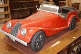 A child's Morgan fibreglass pedal car made by Hamilton Brooks, L.124cmCONDITION: Windshield fixing