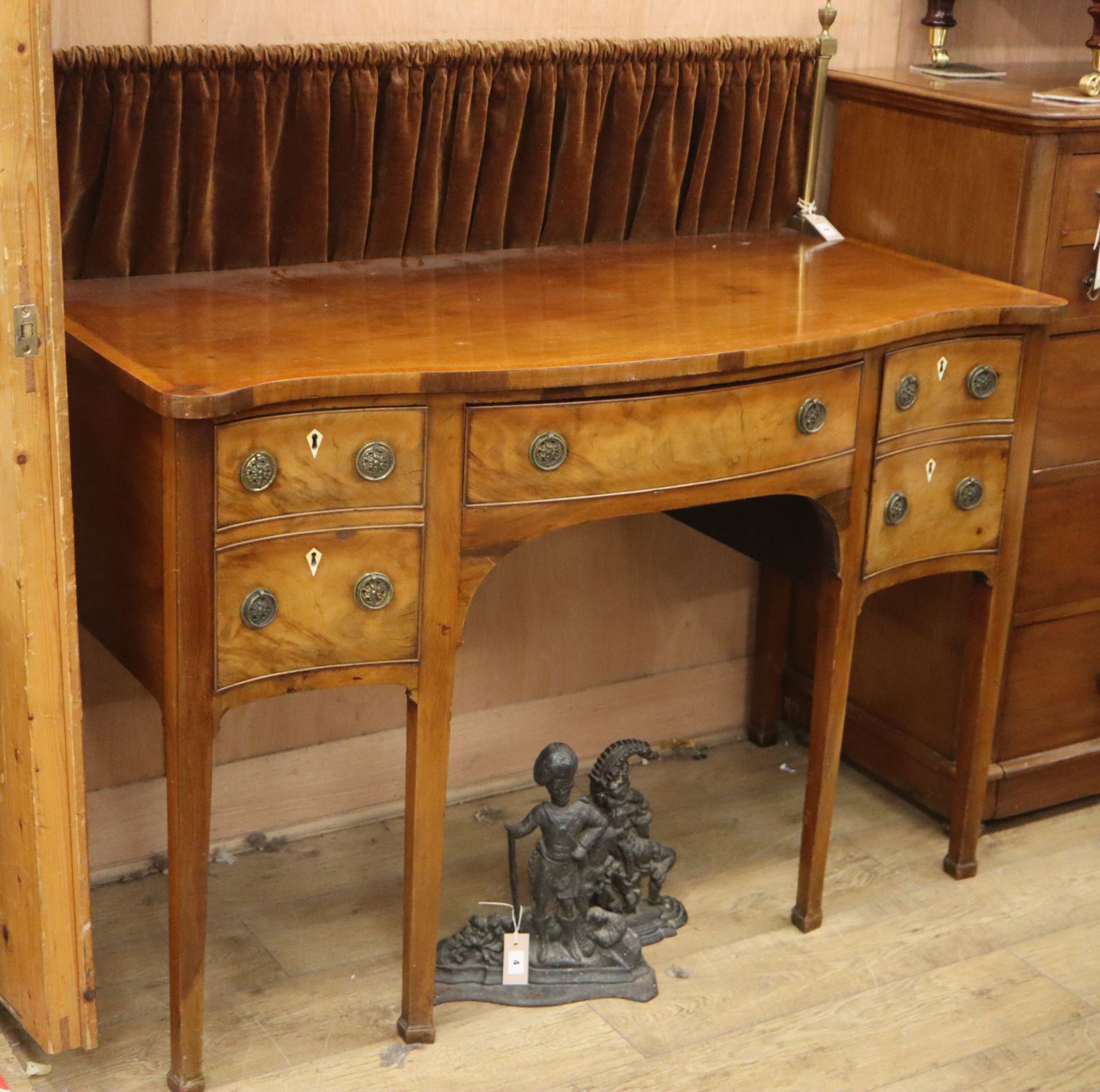 A George III style mahogany serpentine sideboard, W.136cm, D.62cm, H.93cmCONDITION: Overall in - Image 2 of 2