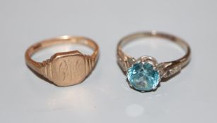 A 9ct gold signet ring(worn), 2.8 grams and a white metal and blue zircon(worn) dress ring, size