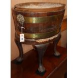 A 19th century brass-bound oval mahogany wine cooler, W.64cm, D.46cm, H.58cm