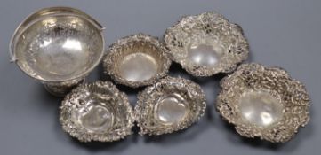 A George V silver pedestal bonbon basket, diameter 10.3cm and six other small silver dishes