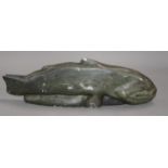 An Inuit soapstone 'fish' carving, length 37cm