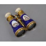 A pair of gilt brass and enamel opera glasses, with mother of pearl overlay and painted Italian