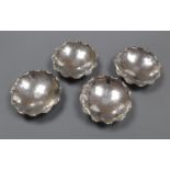 A set of four early 20th century Chinese white metal nut dishes, maker, WK, 93mm, 5.5oz.CONDITION: A