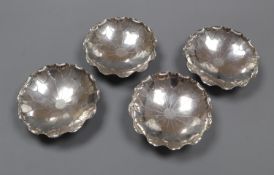 A set of four early 20th century Chinese white metal nut dishes, maker, WK, 93mm, 5.5oz.CONDITION: A