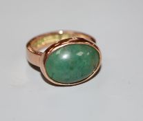 A George V 9ct gold and cabochon green quartz set dress ring, size O, gross weight 7.4 grams.