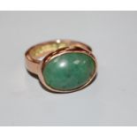 A George V 9ct gold and cabochon green quartz set dress ring, size O, gross weight 7.4 grams.