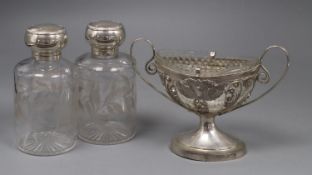 A pair of Edwardian silver mounted etched glass scent bottles, 16cm and a continental white metal