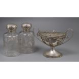 A pair of Edwardian silver mounted etched glass scent bottles, 16cm and a continental white metal