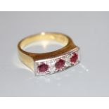 A modern 18ct yellow metal, three stone ruby and four stone diamond half hoop ring, size O, gross