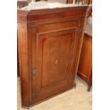 A George III oak hanging corner cupboard, W.82cm, D.41cm, H.106cm