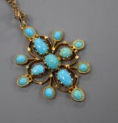 An early 20th century yellow metal and turquoise set pendant, on a yellow metal chain, pendant