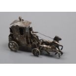 An early 20th century German silver miniature group of a coach and horses, with hinged lid, London
