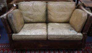 A small vintage two seater Knowle settee upholstered in studded pale brown leather, W.156cm, D.88cm,
