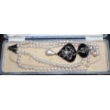 A modern silver, 22ct, black onyx, cultured pearl, sapphire and rose cut diamond set drop pendant,