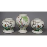 Three mid 20th century Chinese vasesCONDITION: The enamels on the larger vase are faded, all three